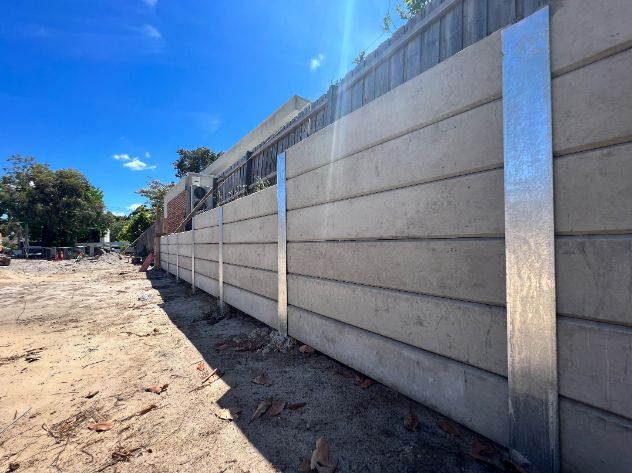 New sleeper wall built by retaining wall builders in Frankston a new concrete sleeper using grey sleepers